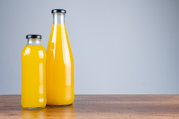 Bottle of orange juice and oranges