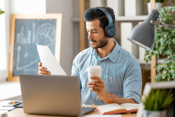 man working on a laptop at home.