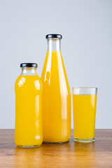 Bottle of orange juice and oranges