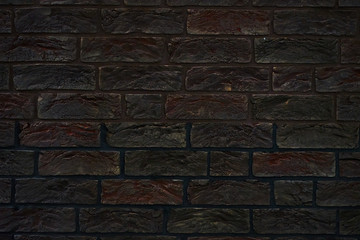 Brick wall made of textured decorative brick.