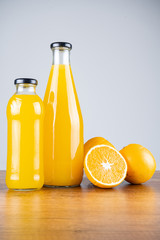 Bottle of orange juice and oranges