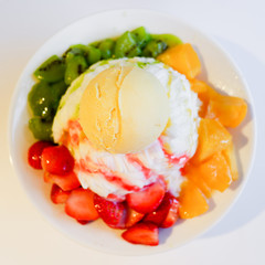 Mixed Fruit Bingsu. A bowl of milk shaved ice served with fresh fruits