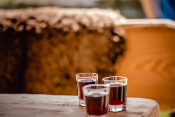 red alcohol shots in small glasses on a celebration