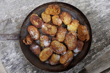Traditional Austrian desert „Pofesen“ (french toast with sugar and plum jam) served in an iron pan on an alpine hut