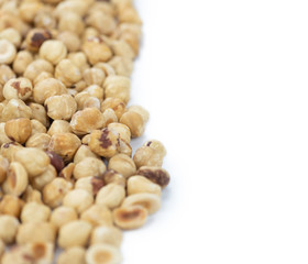 Peeled Hazelnuts isolated on white (close up shot; selective focus)