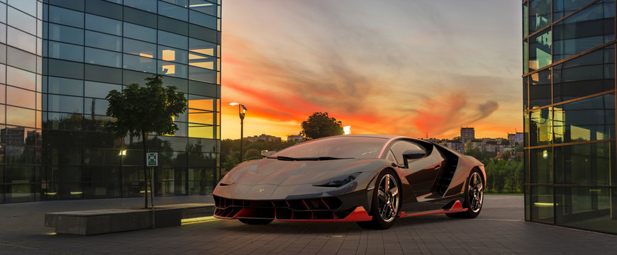 Lamborghini Centenario presenting itself against the backdrop of modern architecture