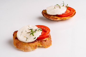 mozzarella with tomato slice on the toast