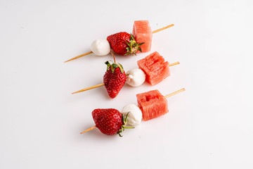 Strawberry with mozzarella and watermelon on the stud