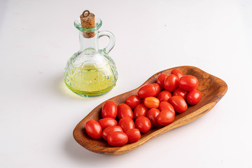cherry tomatoes on wooden plate