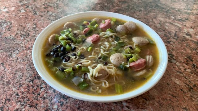 Black beans meaty hot noodle soup