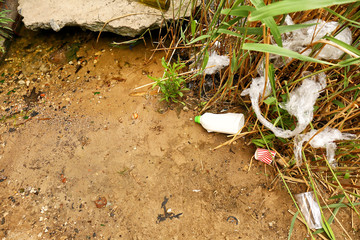 View of garbage near river outdoors. Concept of soil pollution