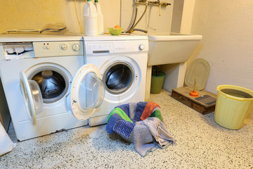 two washing machines in the attic of the hostel for washing clot