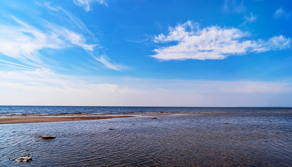 Seascape. Sandy beach on the sea on a Sunny day.