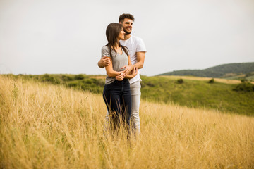 Young couple in love outside in spring nature