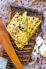 Tortillas flatbread naan with herbs and spices.