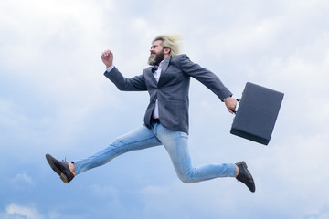 Business. Advertising. Businessman running with suitcase. CEO. Businessman in suit. Business, people and office concept. Bearded businessman with case. Business concept.