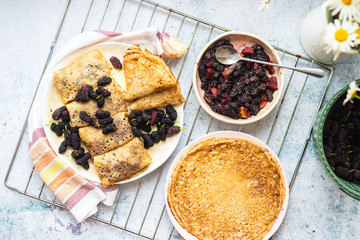 Baked french crepes, thin pancakes with sweet mulberry filling