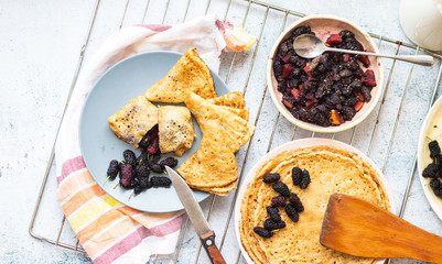 Baked french crepes, thin pancakes with sweet mulberry filling