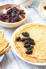 Baked french crepes, thin pancakes with sweet mulberry filling
