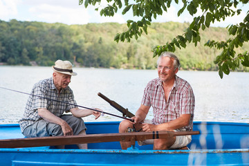 Two seniors in the boat fishing