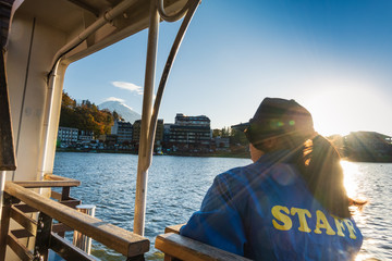 Yamanashi , Japan - November 19, 2019 : Staff of Ensoleille Excursion Ship Pleasure Boat Kawaguchiko is looking at Mount Fuji.