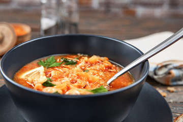 Red soup with vegetables and meat, tasty, traditional Ukrainian borsch, close-up, shallow depth of field, selective focus. Healthy Organic Homemade Food Concept