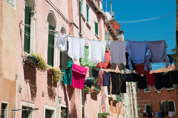 Fototapeta na wymiar Drying washed clothes in the streets of Venice, Italy, italian lifestyle
