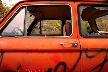 Old car in lush lava color. A retro car that looks stylish.