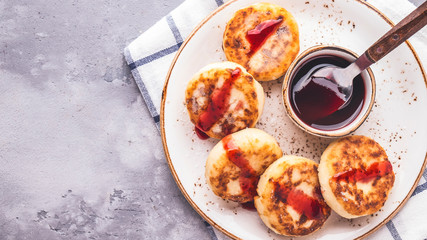 Cottage cheese pancakes with jam. Healthy breakfast concept. Copy space, text space