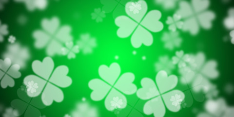 Abstract flashy green background with flying four leaf clovers