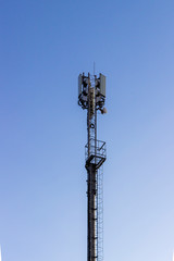 Technician on telecommunication antenna tower 5G..