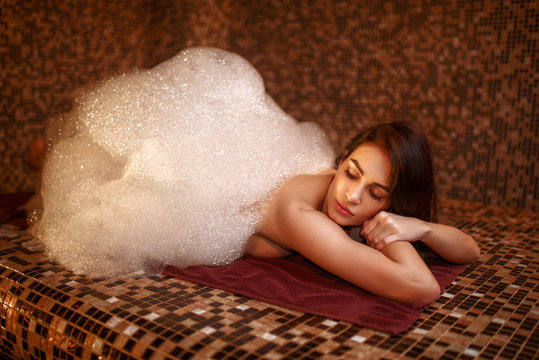 Woman in foam, turkish bath, hamam
