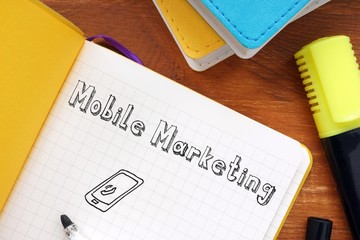 Financial concept meaning Mobile Marketing with phrase on the sheet.