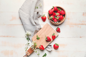 Composition with ripe strawberry on table