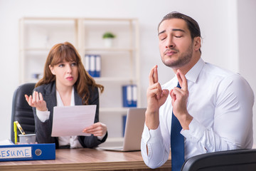 Business meeting between businessman and businesswoman