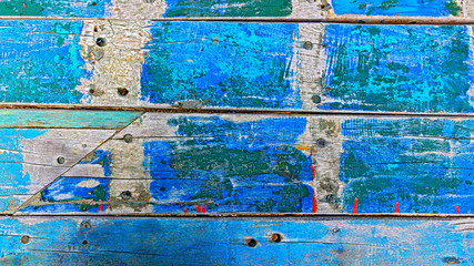 Old wooden boards partially colorfully painted