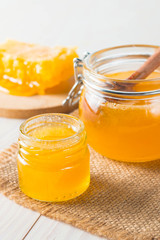 honey dipper and honeycomb. nuts and apples with honey and nuts of various kinds