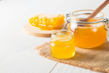 honey dipper and honeycomb. nuts and apples with honey and nuts of various kinds