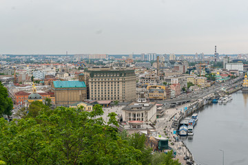 A beatiful view on the center of Kyiv, business and residential buildings, nature in the city, bridge and Dniepr river