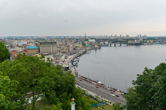 A beatiful view on the center of Kyiv, business and residential buildings, nature in the city, bridge and Dniepr river