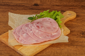 Slised ham snack over board