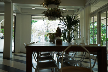 Interior design and decoration of local coffee bar and restaurant decorated with wooden furniture