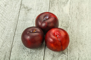 Ripe sweet plum fruit heap