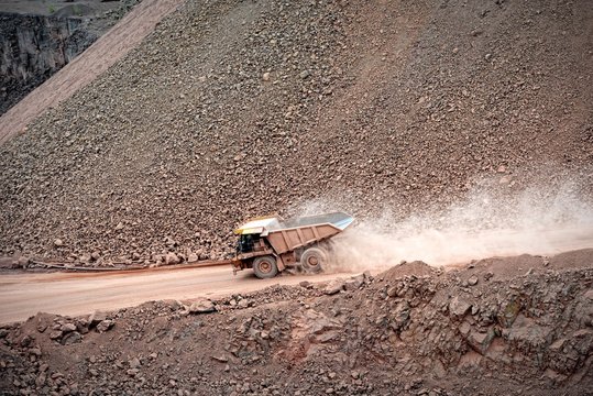 High Angle View Of Dump Truck On Dirt Road