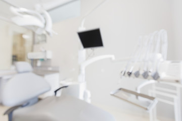 Blurred empty dentist workplace with professional equipment