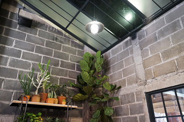 Interior design and decoration of loft building built with concrete cement block and brick wall