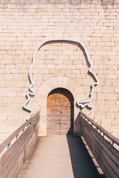 Lacoste, Vaucluse, Provence-Alpes-Cote d'Azur, France, September 25, 2018: The contour of the head of the Marquis de Sade around the gate to the castle of Lacoste