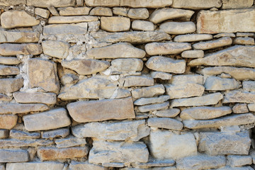 Wall of the old castle made of sandstone.