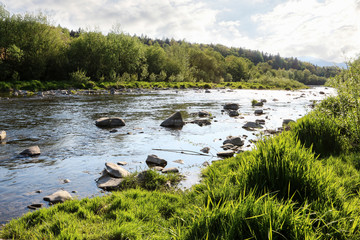 Fototapeta na wymiar Calm river in mountain region.