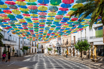 Umbrellas floating in the sky with lots of color in Águeda, Portugal